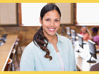 Female teacher smiling with class in background